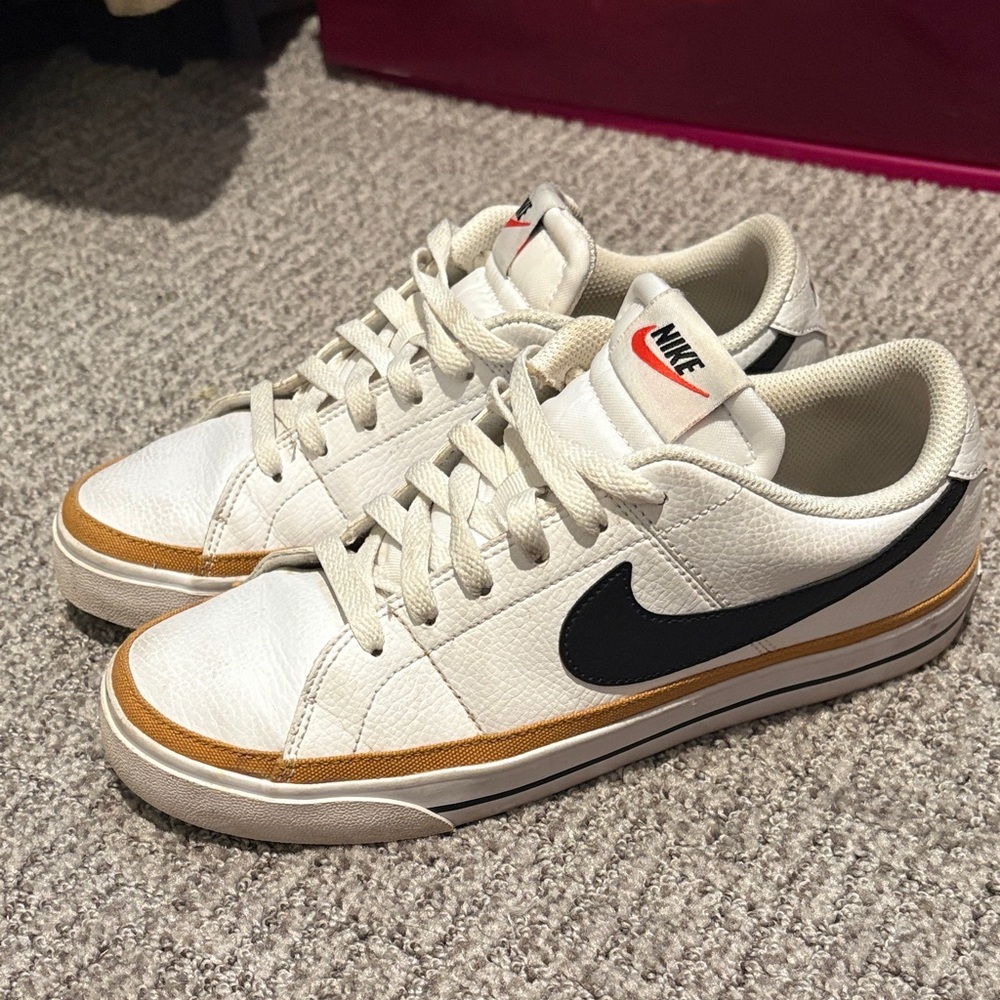 Nike White and Black Sneakers with Gold Accents